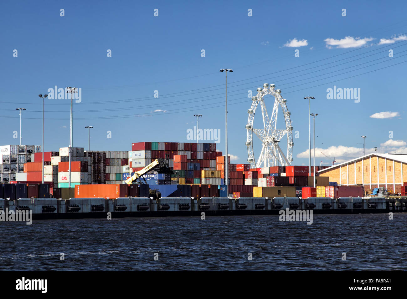 Container terminal and Melbourne Star Observation Wheel on the river