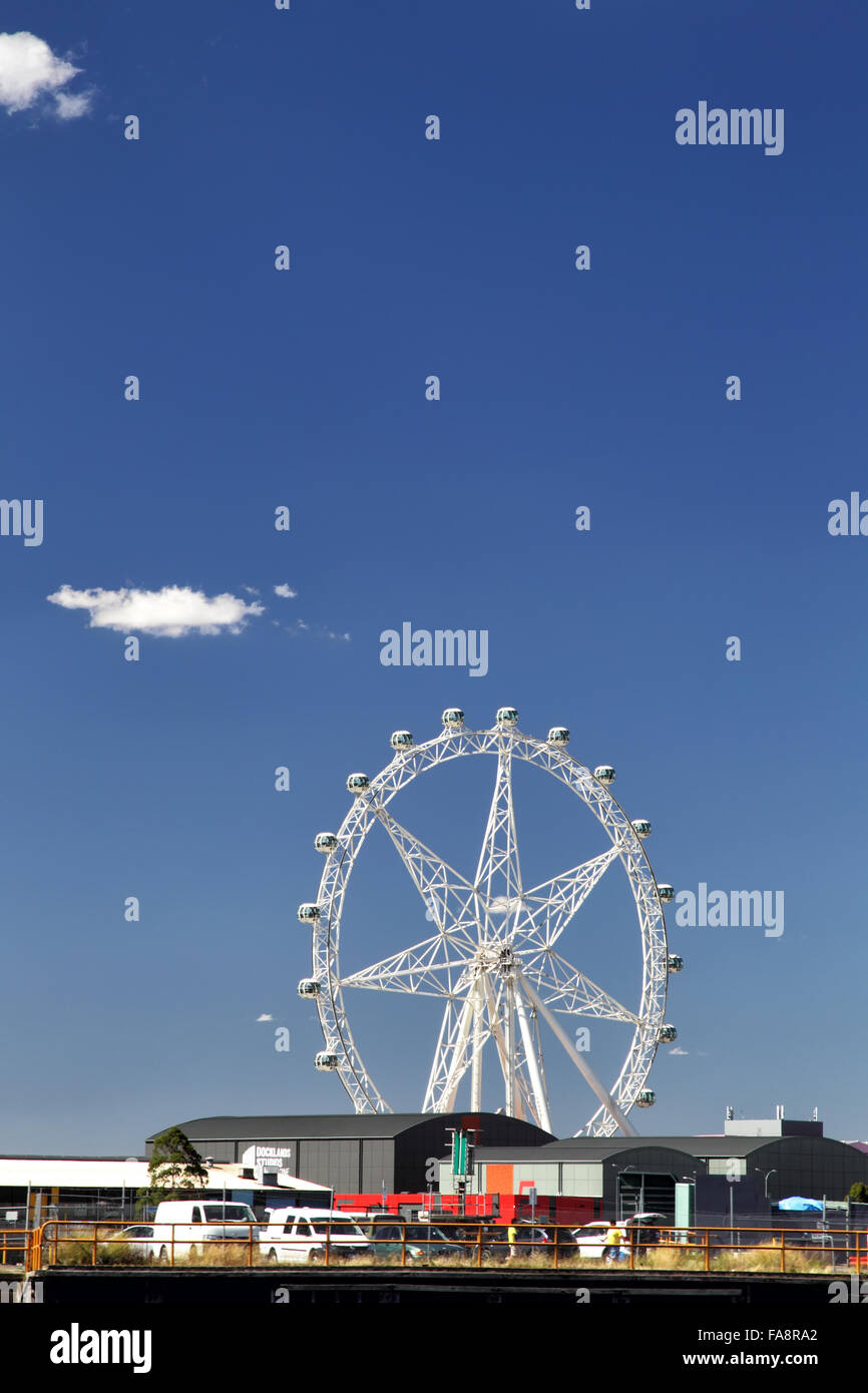 Melbourne Star Observation Wheel on the river bank of the Yarra River in Melbourne, Victoria, Australia, on a sunny summer day. Stock Photo