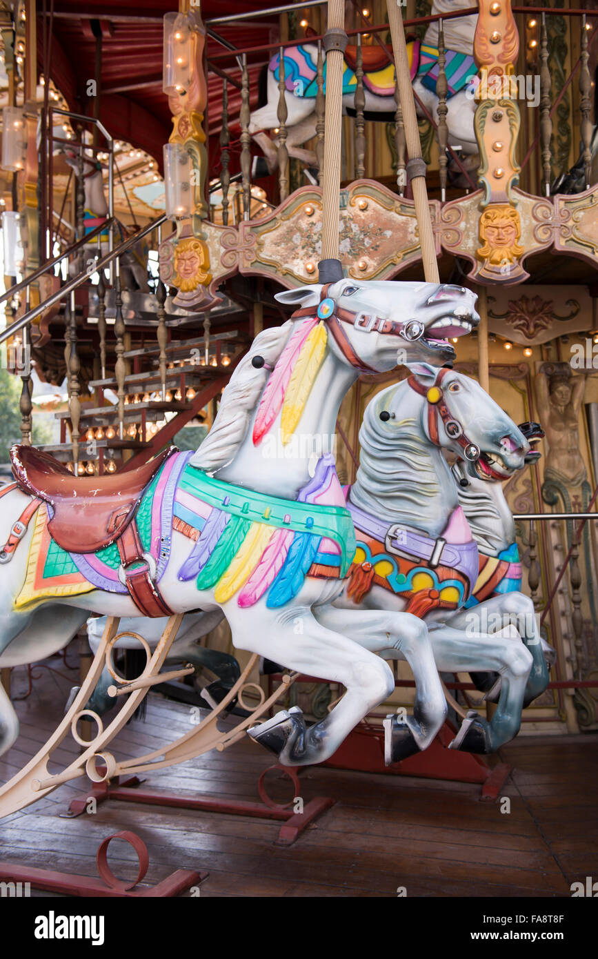 Carousel horses on a traditional French double-decker carousel in the downtown neighborhood of Marseille, France. Stock Photo