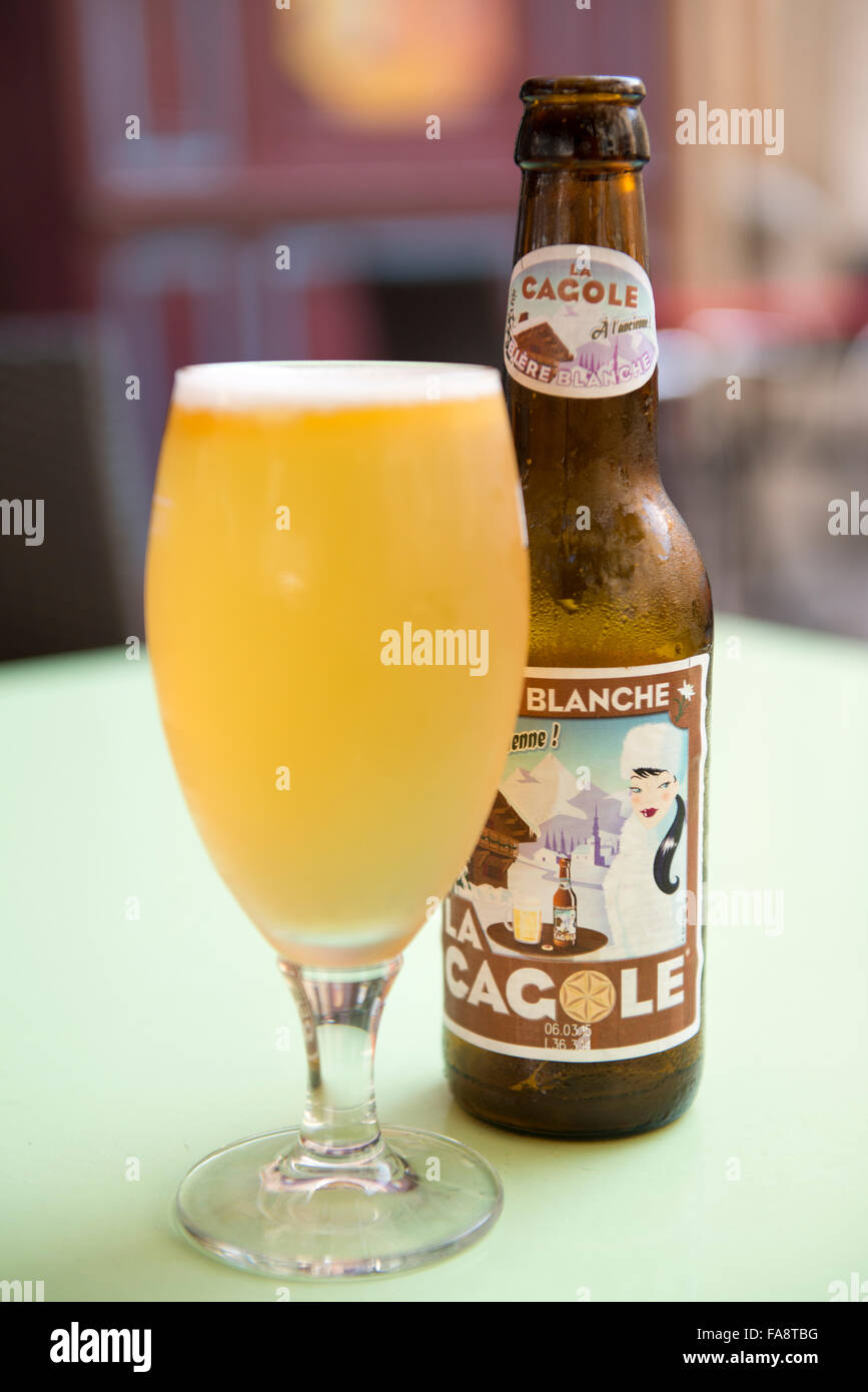 A glass of Cagole beer on a table at Bar des 13 Coins, a bar located in the Panier neighborhood of Marseille, France. Stock Photo