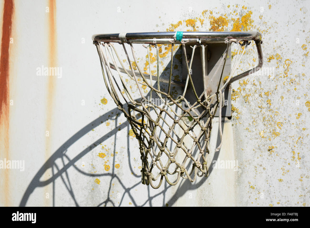 an old basketball hoop in a playground Stock Photo Alamy