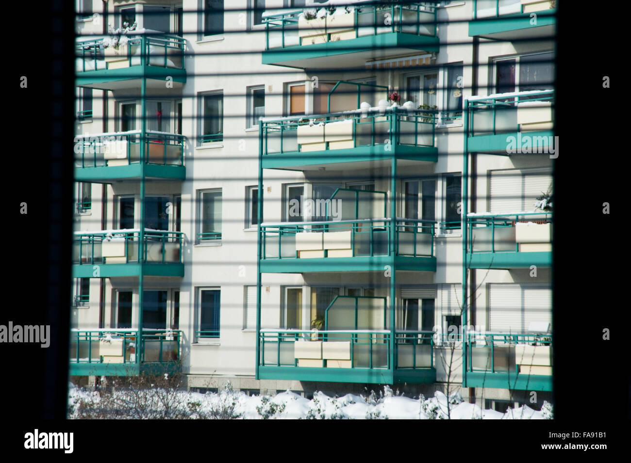 Apartment building seen through blinds Stock Photo Alamy