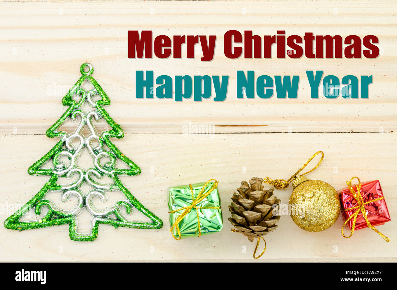 Merry Christmas and happy new year wording with christmas decorations