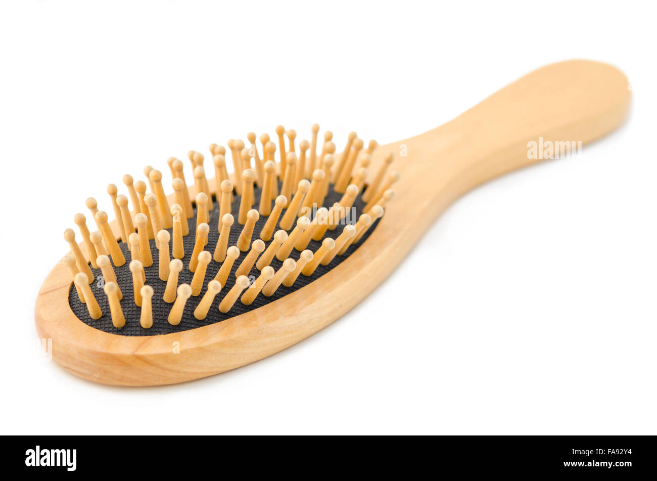 Wooden hair brush isolated on white background. Stock Photo