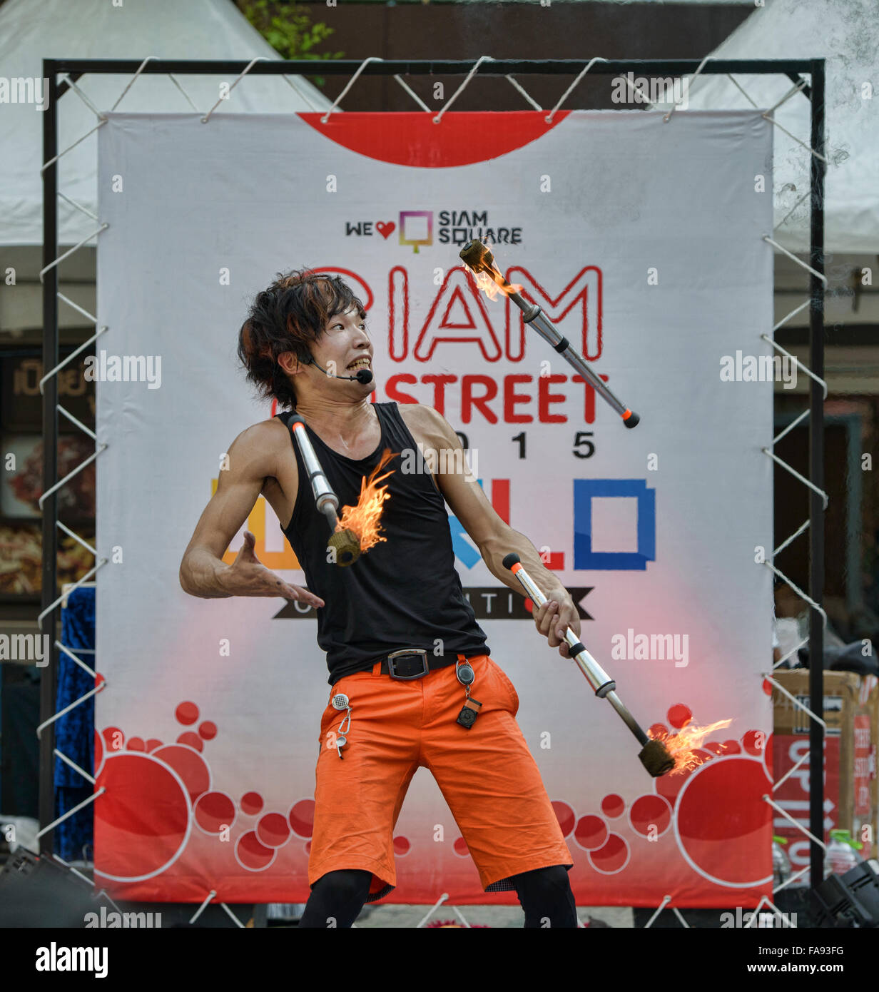 Fire juggling at a street festival in Bangkok, Thailand Stock Photo