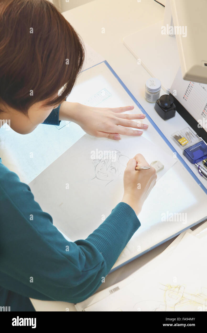 Japanese Manga artist working in the studio Stock Photo - Alamy