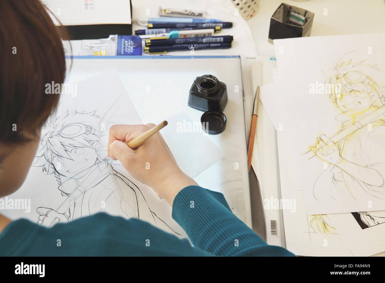 Japanese Manga artist working in the studio Stock Photo - Alamy