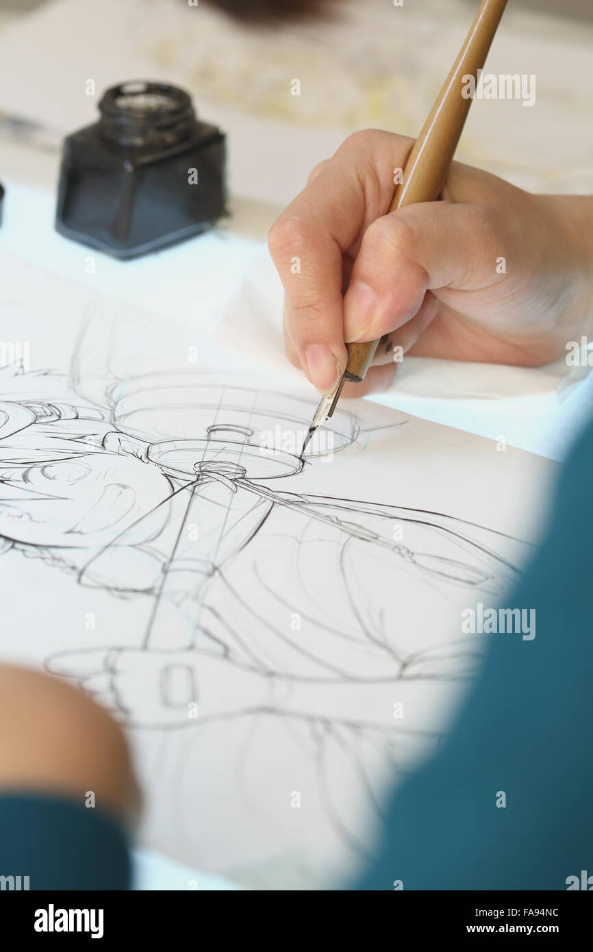Japanese Manga artist working in the studio Stock Photo - Alamy