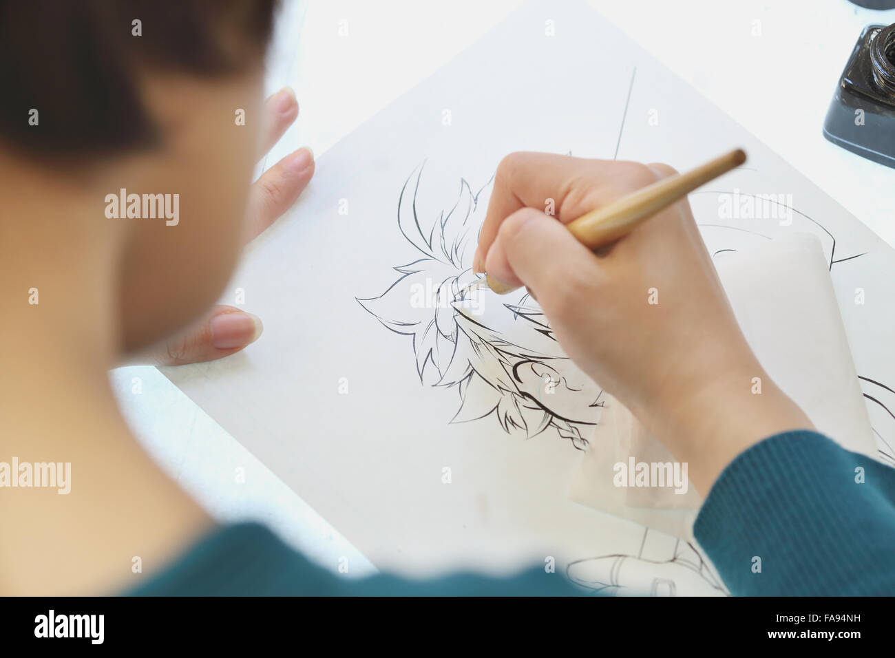 Japanese Manga artist working in the studio Stock Photo - Alamy