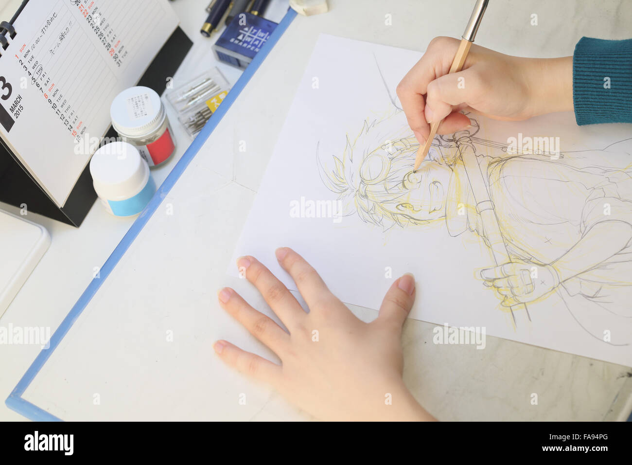 Japanese Manga artist working in the studio Stock Photo - Alamy
