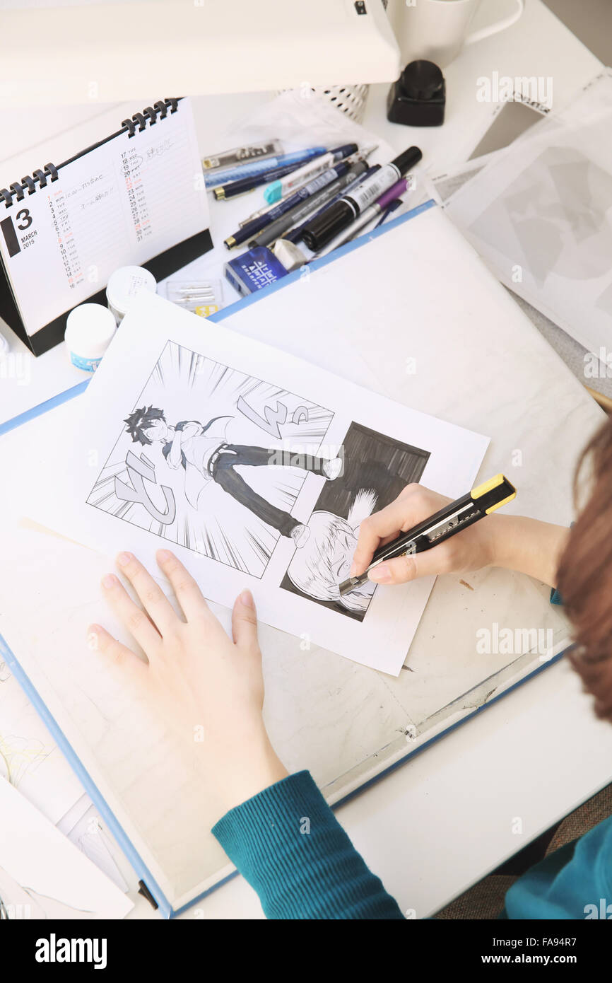 Japanese Manga artist working in the studio Stock Photo - Alamy