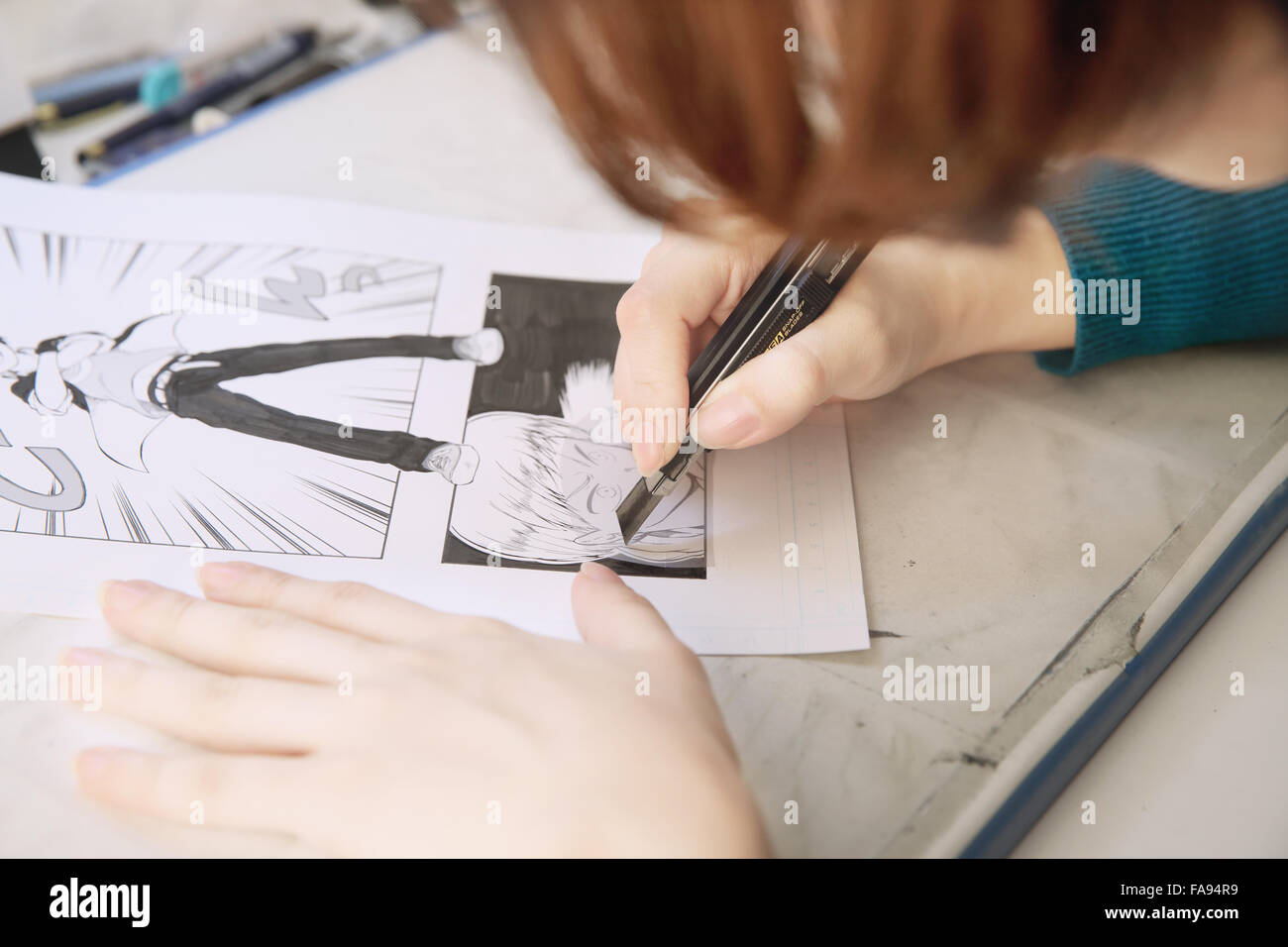 Japanese Manga artist working in the studio Stock Photo - Alamy