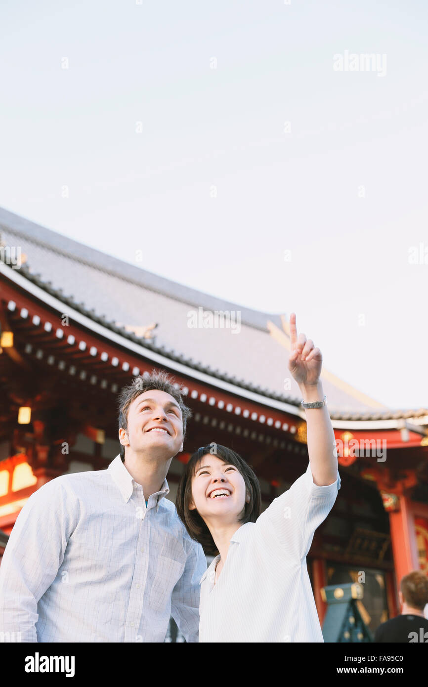 Young multi-ethnic couple enjoying tourism in Tokyo Stock Photo