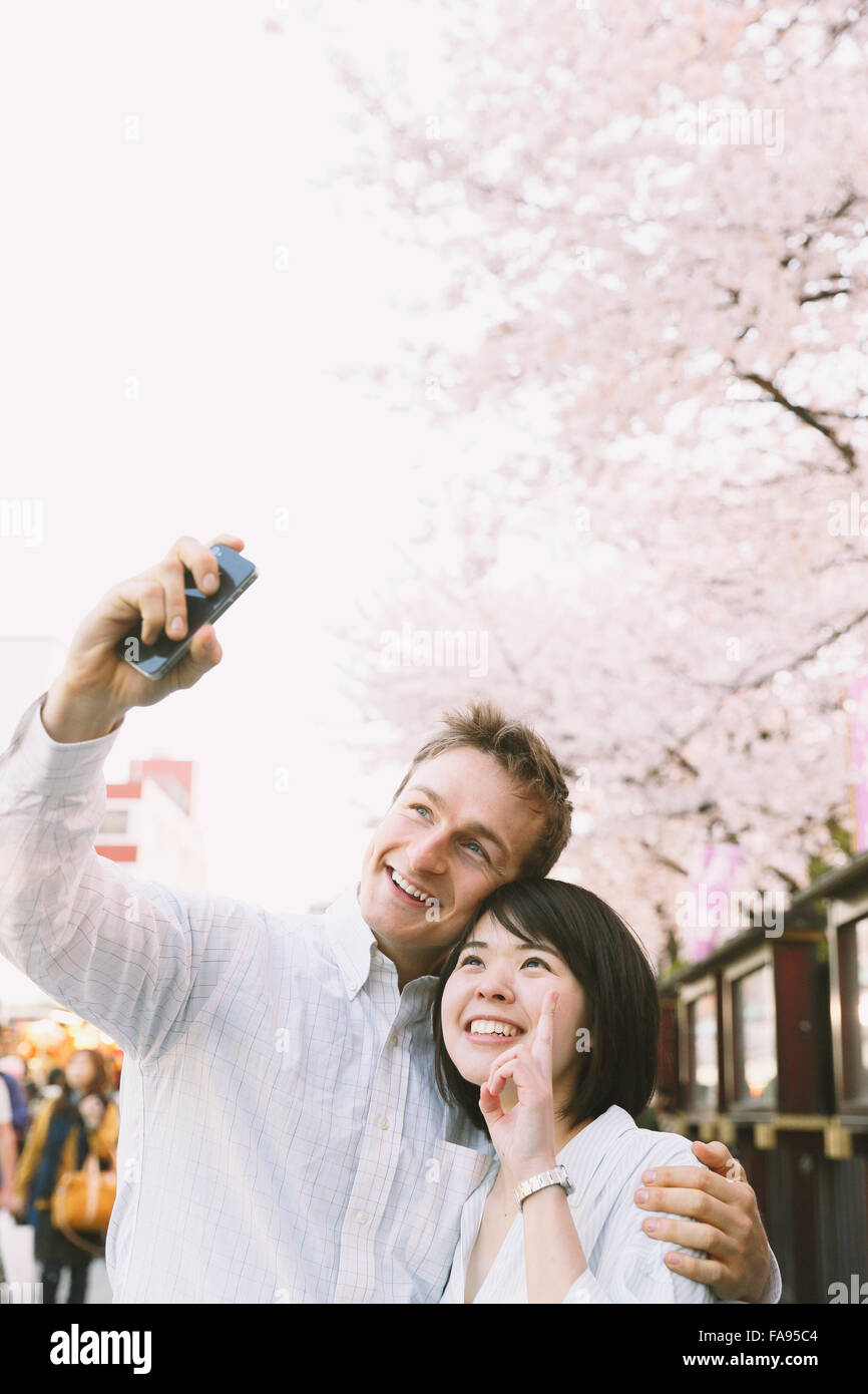 Young multi-ethnic couple enjoying tourism in Tokyo Stock Photo