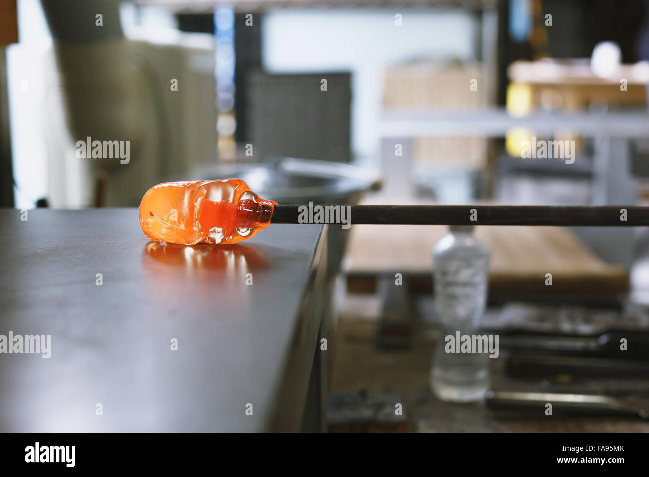 Glass being prepared in artisan studio Stock Photo