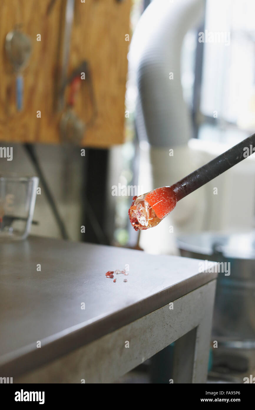 Glass being prepared in artisan studio Stock Photo