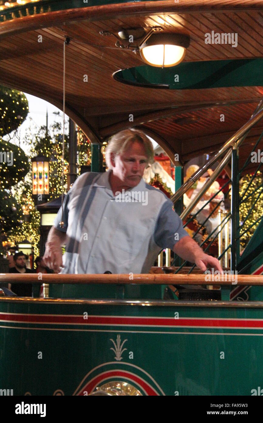 Gary Busey poses on a tram at The Grove with girlfriend Steffanie Sampson and their son Luke  Featuring: Gary Busey Where: Los Angeles, California, United States When: 22 Nov 2015 Stock Photo