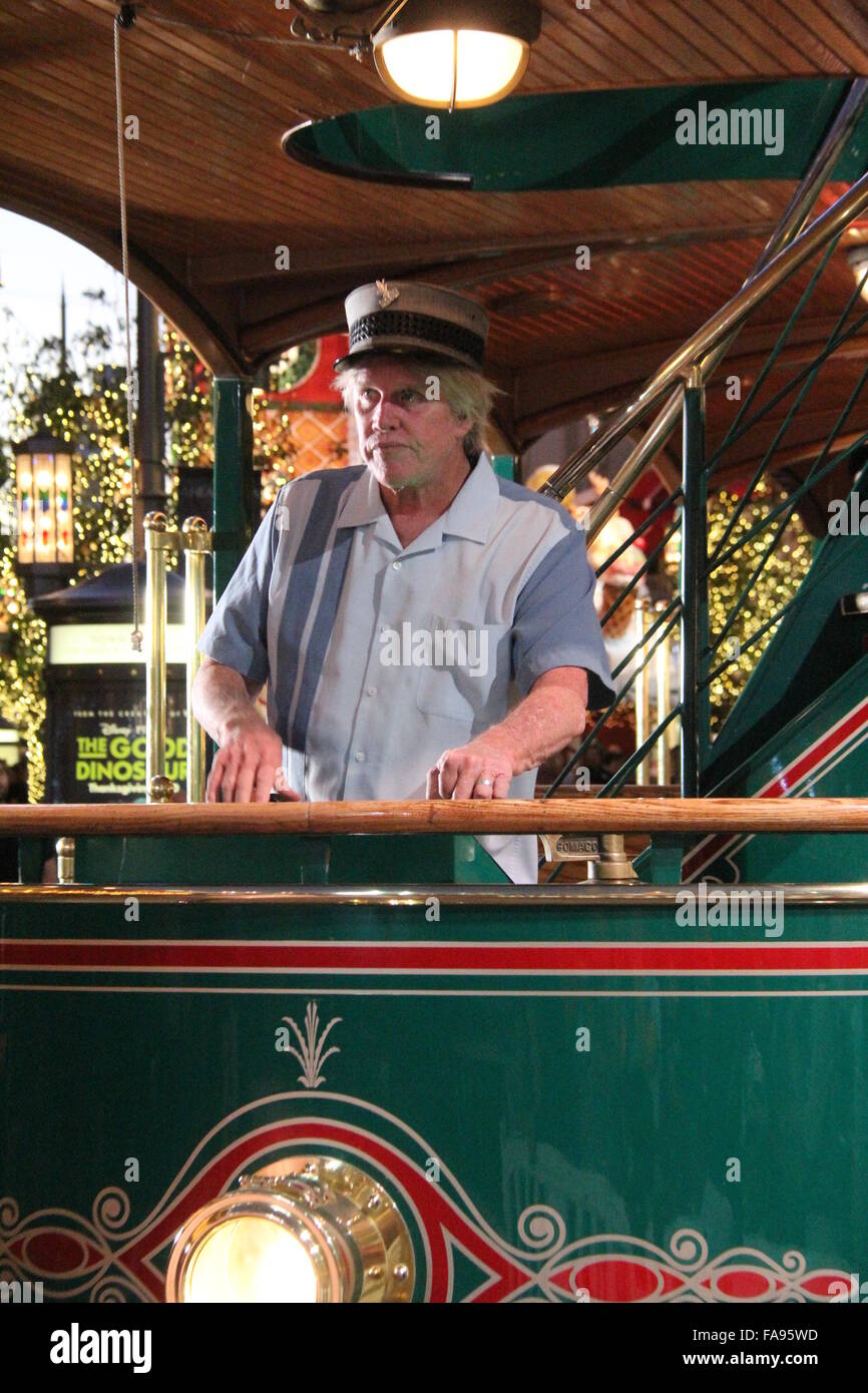 Gary Busey poses on a tram at The Grove with girlfriend Steffanie Sampson and their son Luke  Featuring: Gary Busey Where: Los Angeles, California, United States When: 22 Nov 2015 Stock Photo