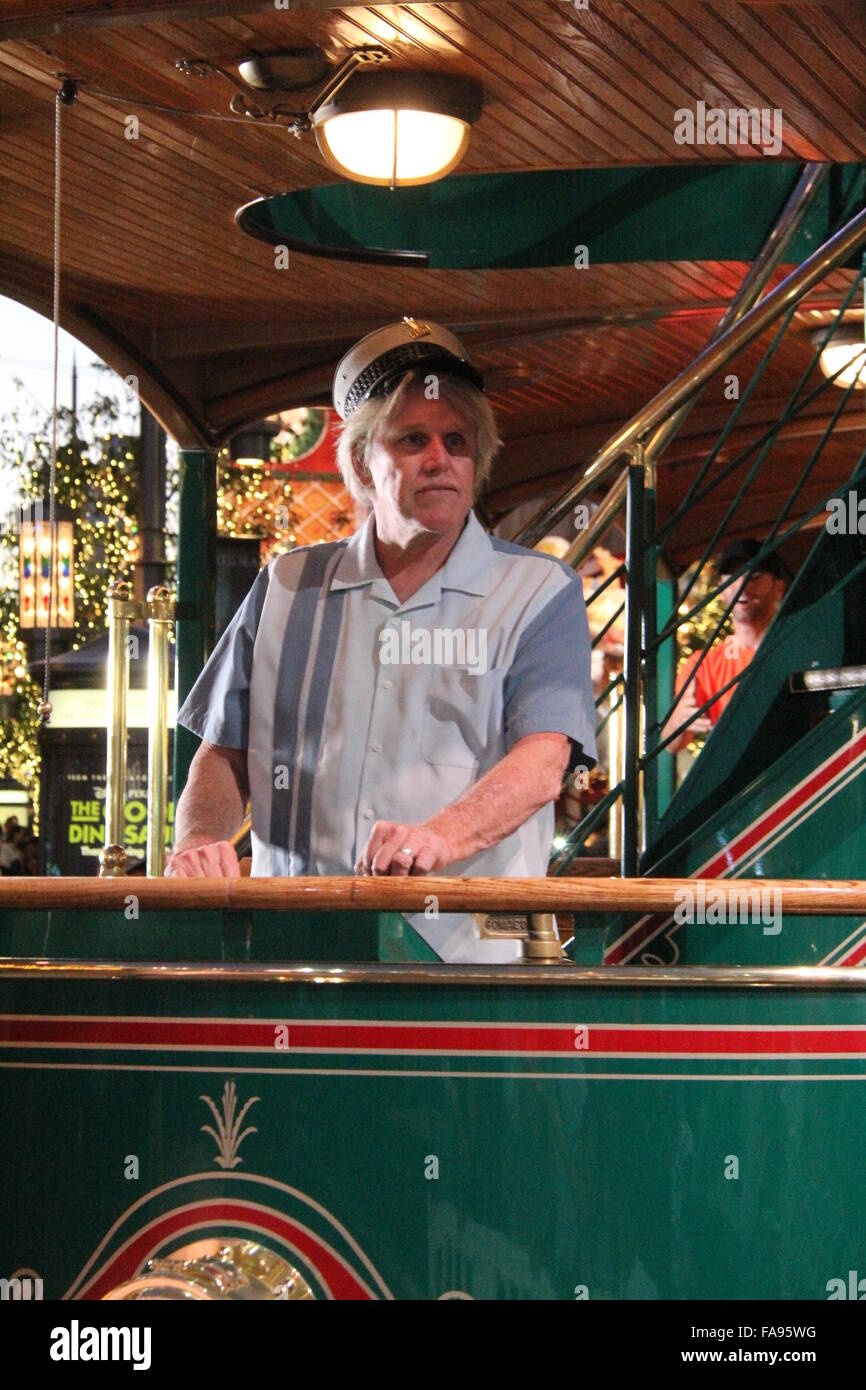 Gary Busey poses on a tram at The Grove with girlfriend Steffanie Sampson and their son Luke  Featuring: Gary Busey Where: Los Angeles, California, United States When: 22 Nov 2015 Stock Photo