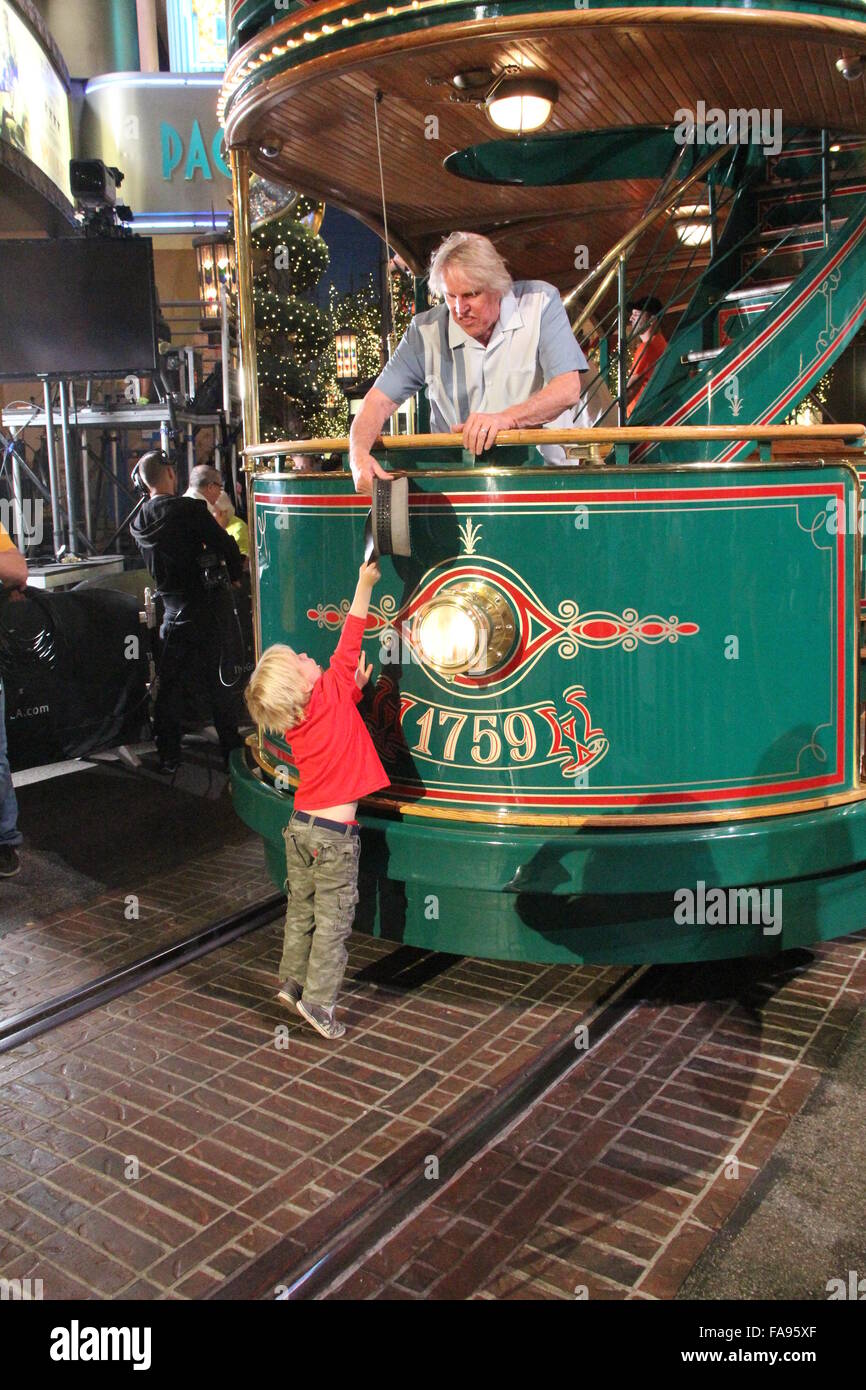 Gary Busey poses on a tram at The Grove with girlfriend Steffanie Sampson and their son Luke  Featuring: Gary Busey, Luke Sampson Busey Where: Los Angeles, California, United States When: 22 Nov 2015 Stock Photo