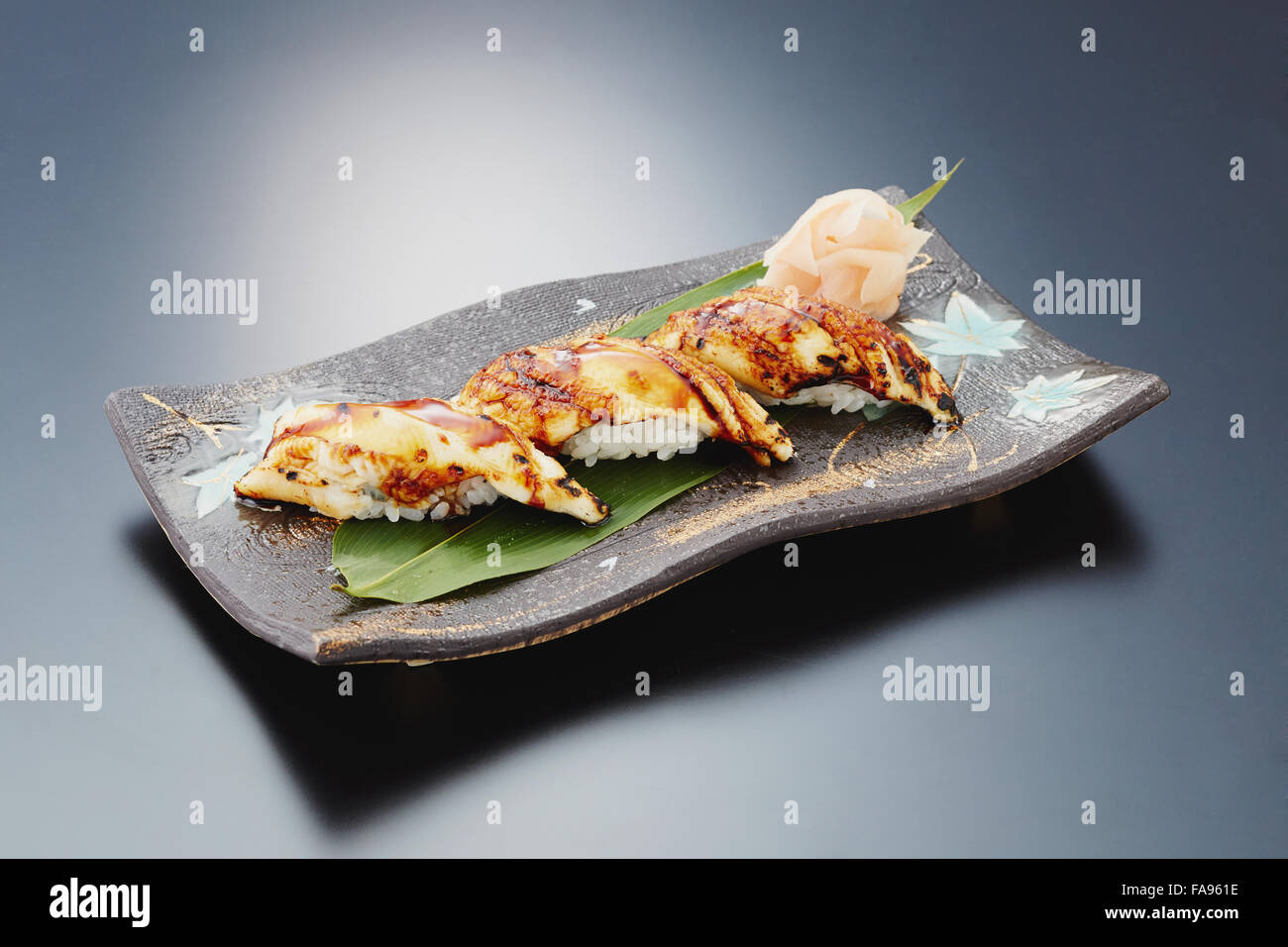Sushi plate on black desk Stock Photo