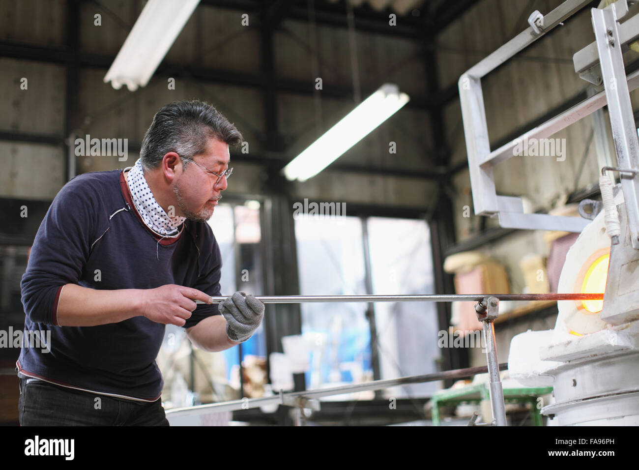 Japanese glass artisan working in the studio Stock Photo