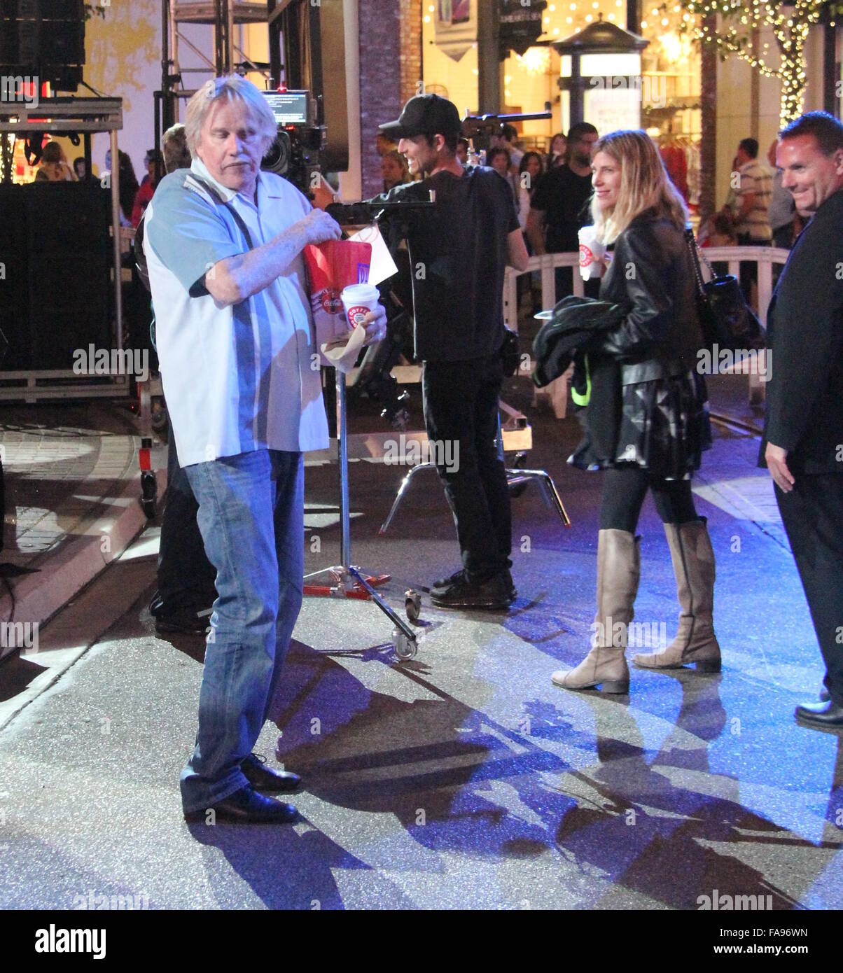 Gary Busey dances with his girlfriend Steffanie Sampson at The Grove  Featuring: Gary Busey, Steffanie Sampson Where: Los Angeles, California, United States When: 22 Nov 2015 Stock Photo