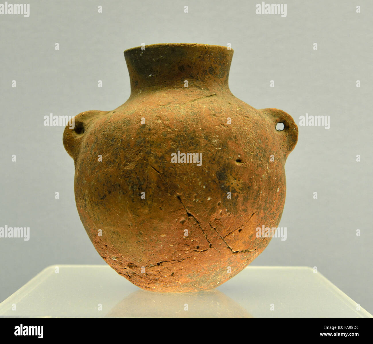 Shanghai Museum. Red Pottery Pot With Two Ears, Peiligang Culture, 60005200 B.C. Stock Photo