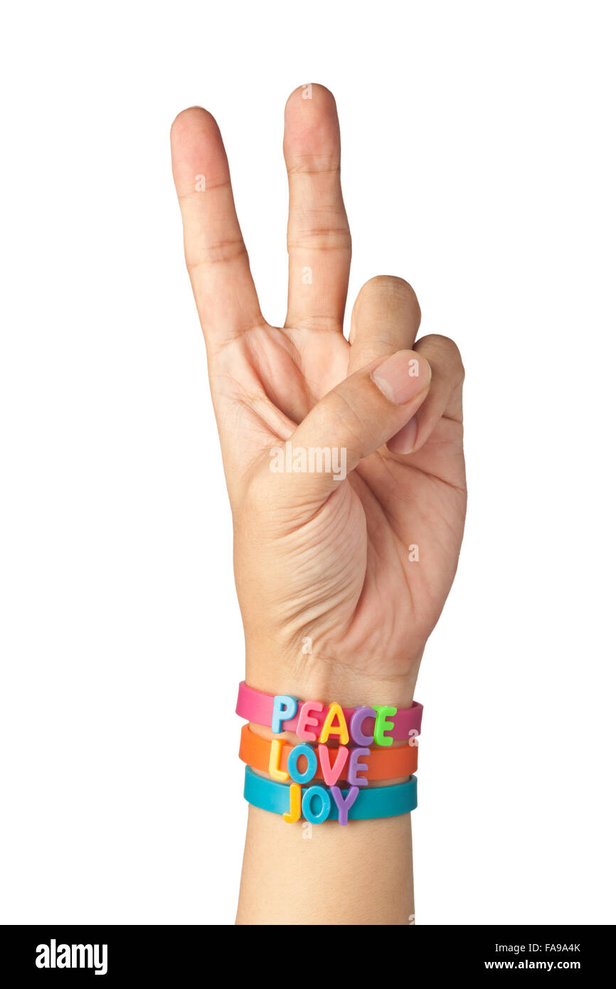 Bracelets on hand with the words PEACE, LOVE and JOY isolated on white background Stock Photo