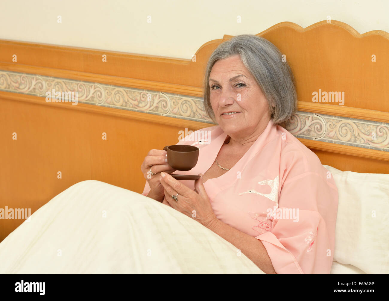 Mature woman with coffee Stock Photo