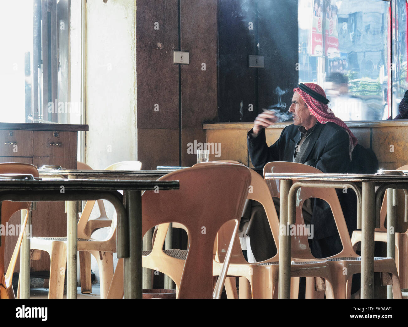 old arab man smoking inside cafe in damascus syria Stock Photo