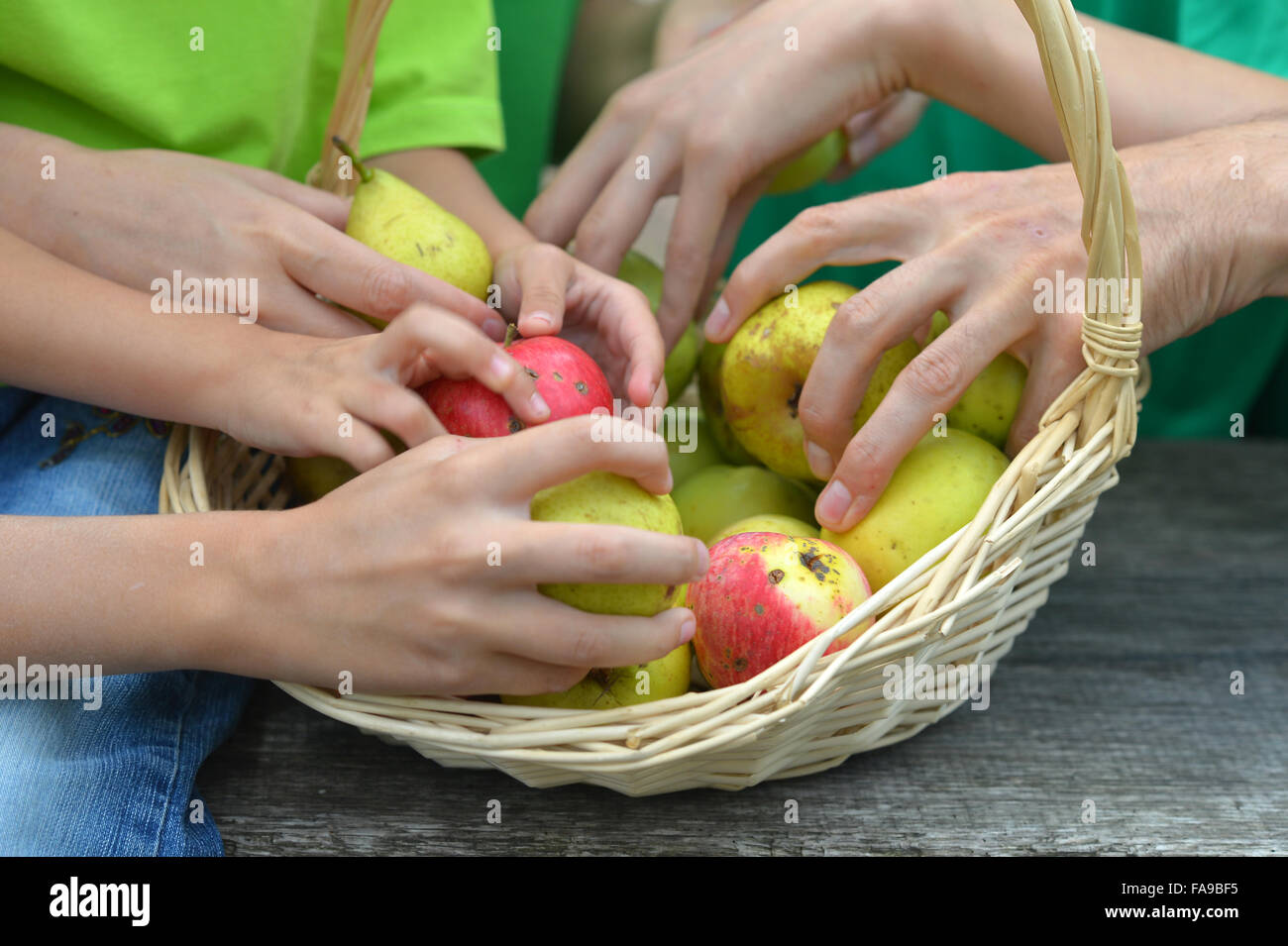 Family with fruits basket Stock Photo Alamy