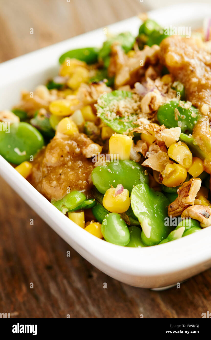 Corn and Fava Bean Salad with a Walnut-Miso Dressing Stock Photo