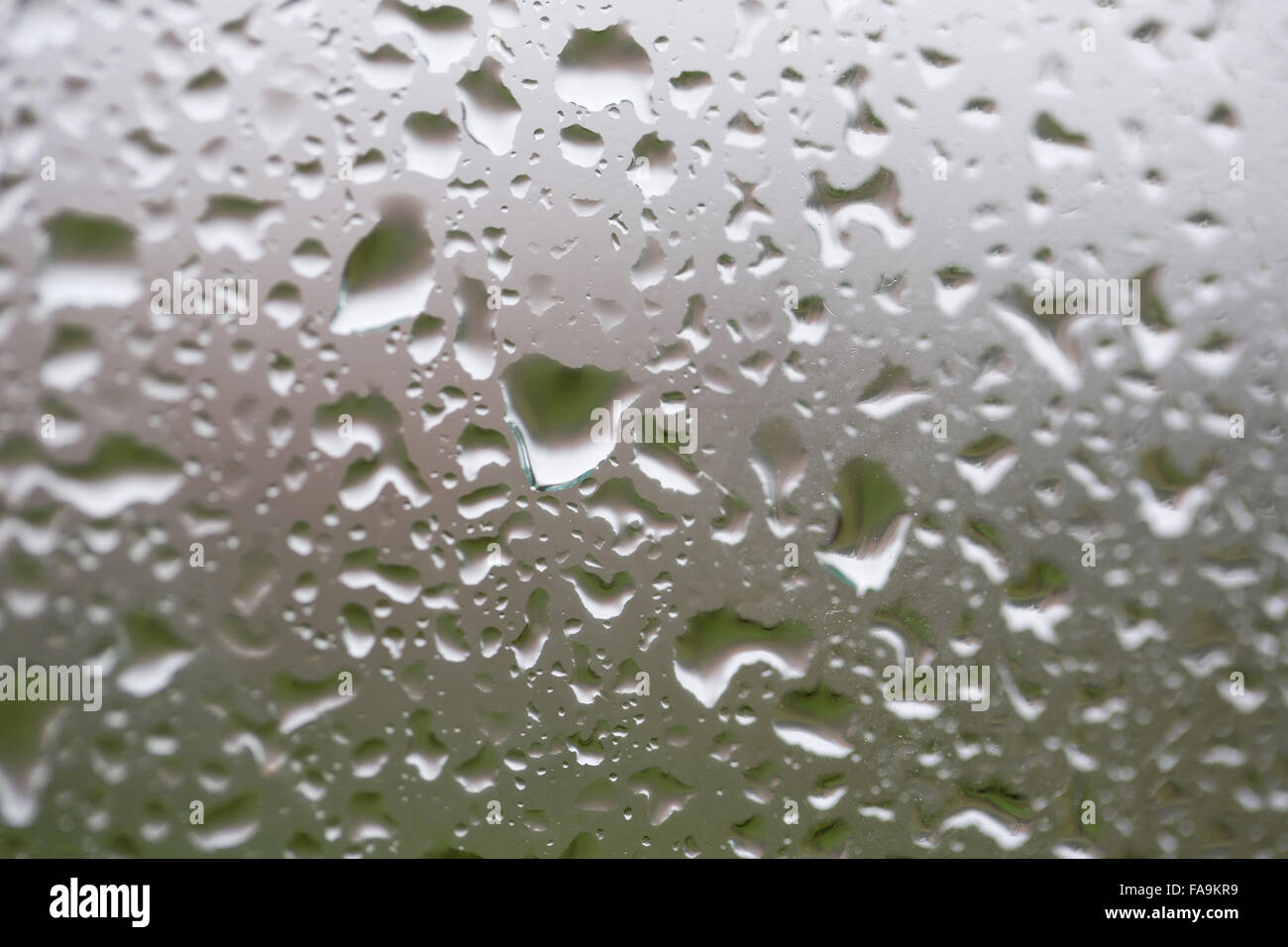 Glass surface with water drops in a rainy day Stock Photo - Alamy