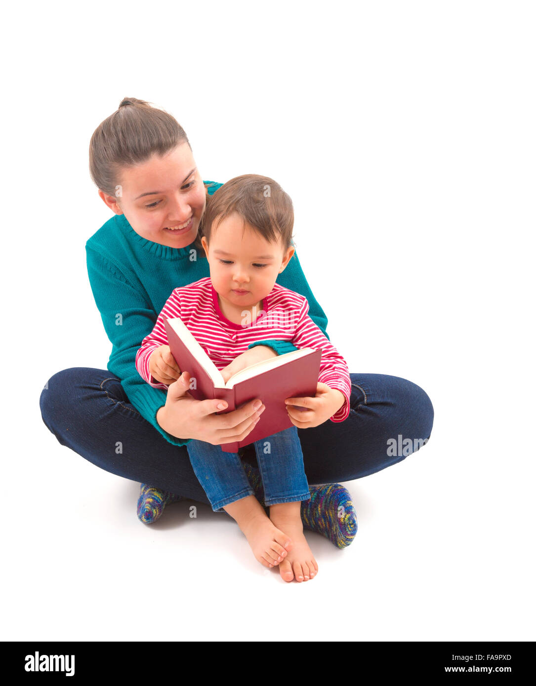 big sister reading to her little sister a story Stock Photo