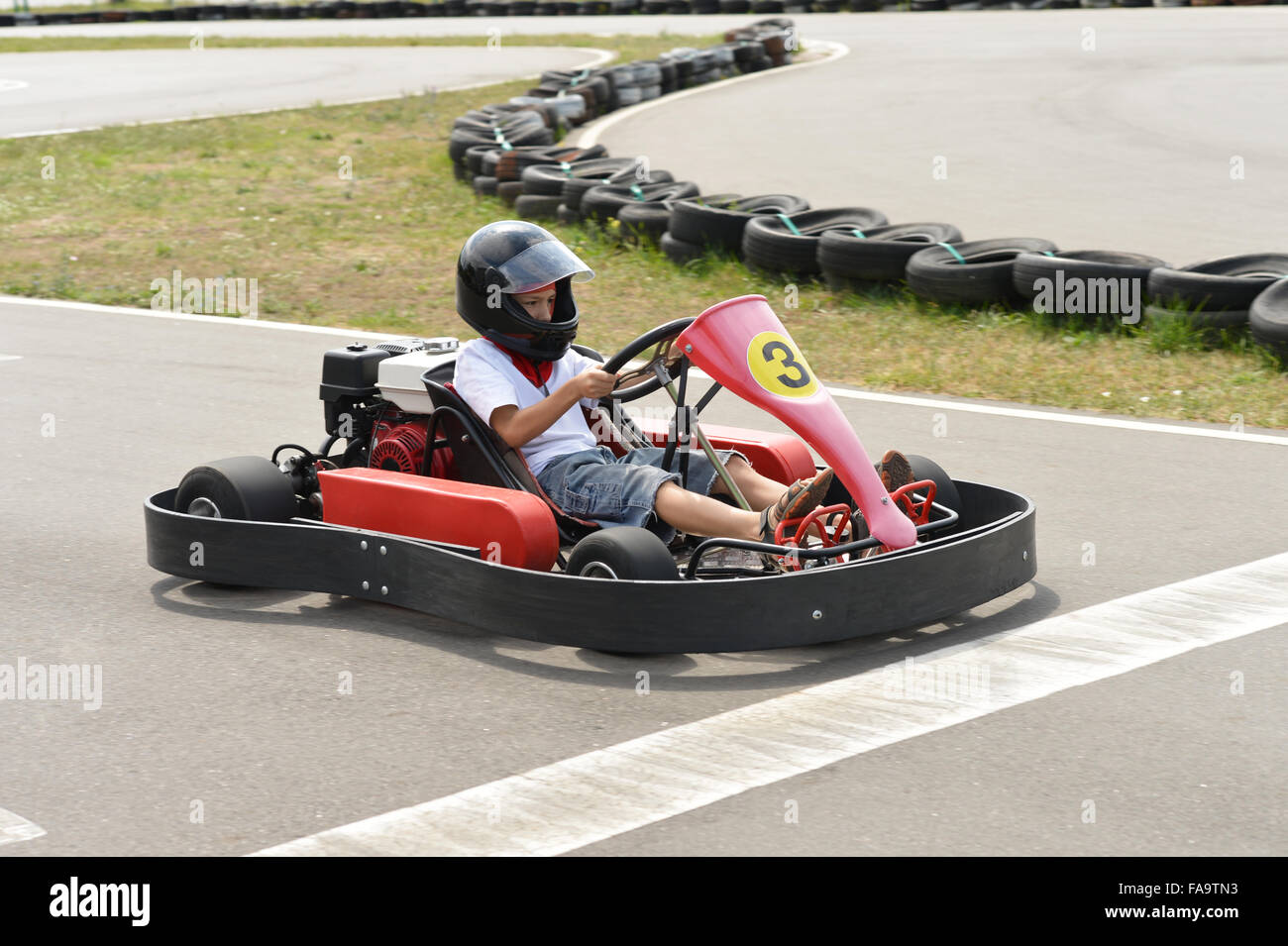 Teenage boy sitting in go-kart Stock Photo