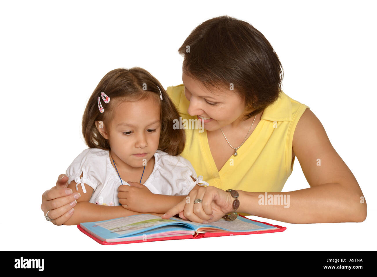 Mother doing homework with  daughter Stock Photo