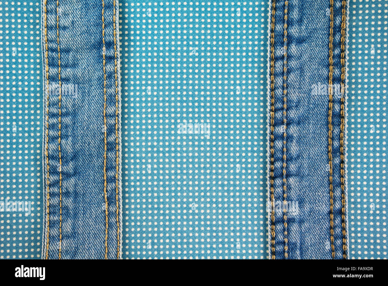Jeans with stitch on blue dot cloth texture and background Stock Photo