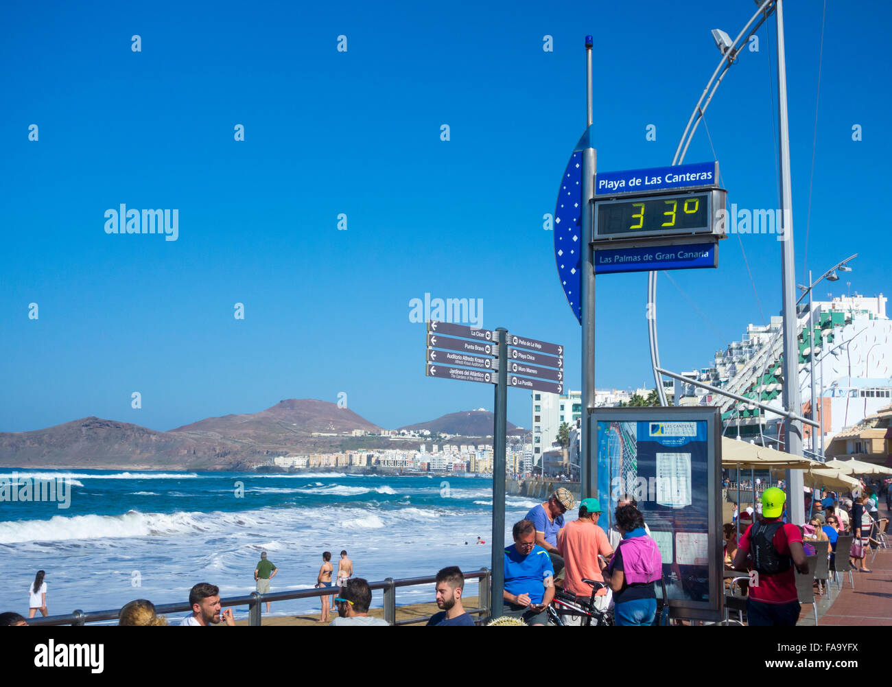 Las Palmas, Gran Canaria, Canary Islands, Spain. 24th December, 2015.  Weather: As another winter storm hits the UK, it`s a glorious Christmas Eve  on Las Canteras beach in Las Palmas on Gran