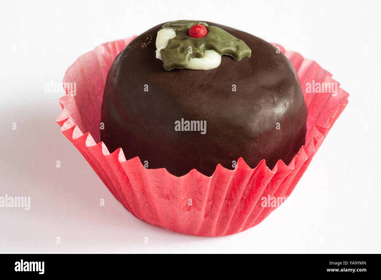 Christmas pudding chocolate truffle cake isolated on white background Stock Photo