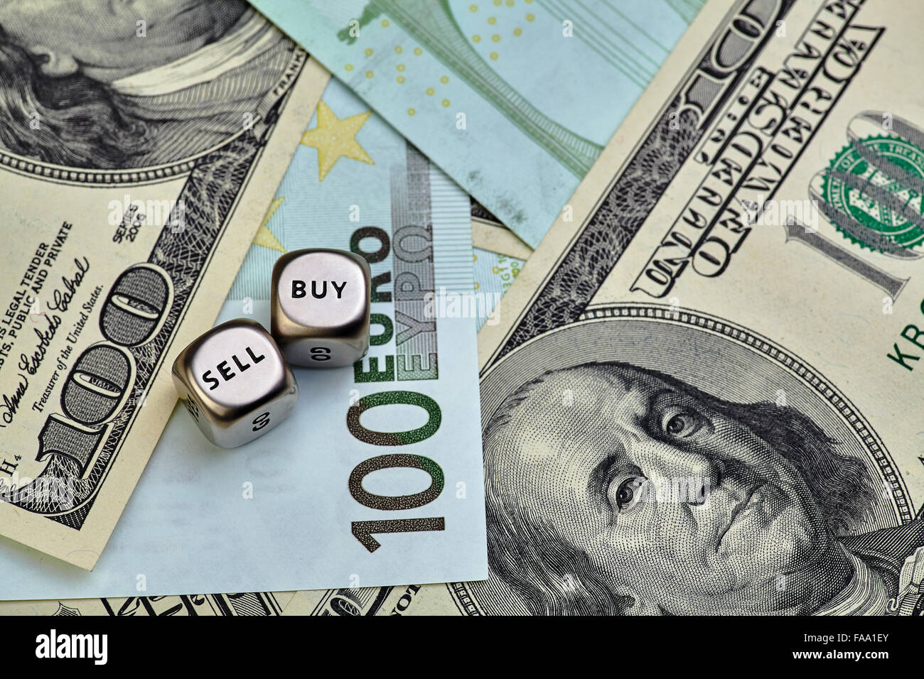 EURO, USD banknotes and dices cubes. Selective focus Stock Photo