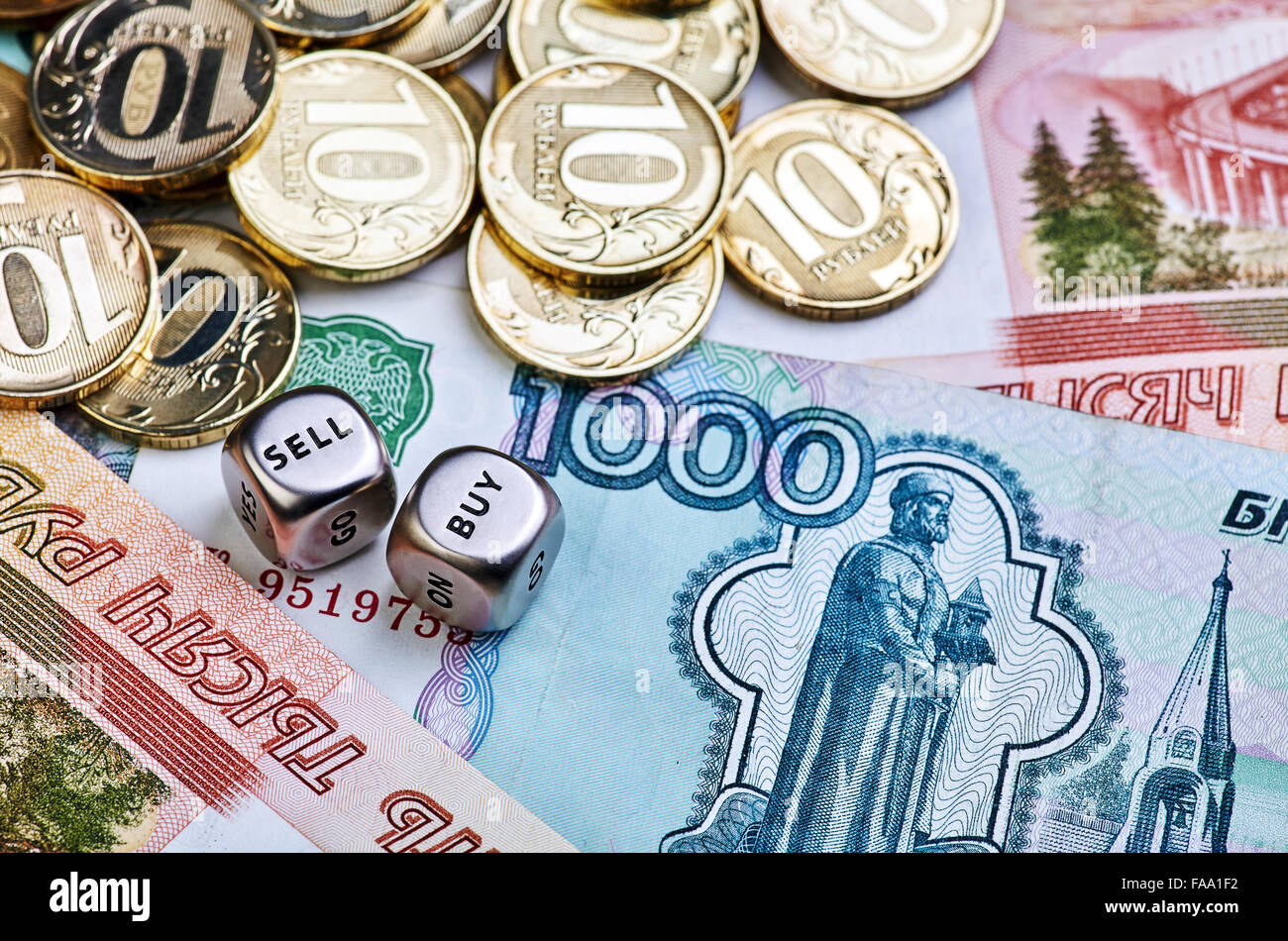 Coins, ruble banknotes and dices cubes. Selective focus Stock Photo