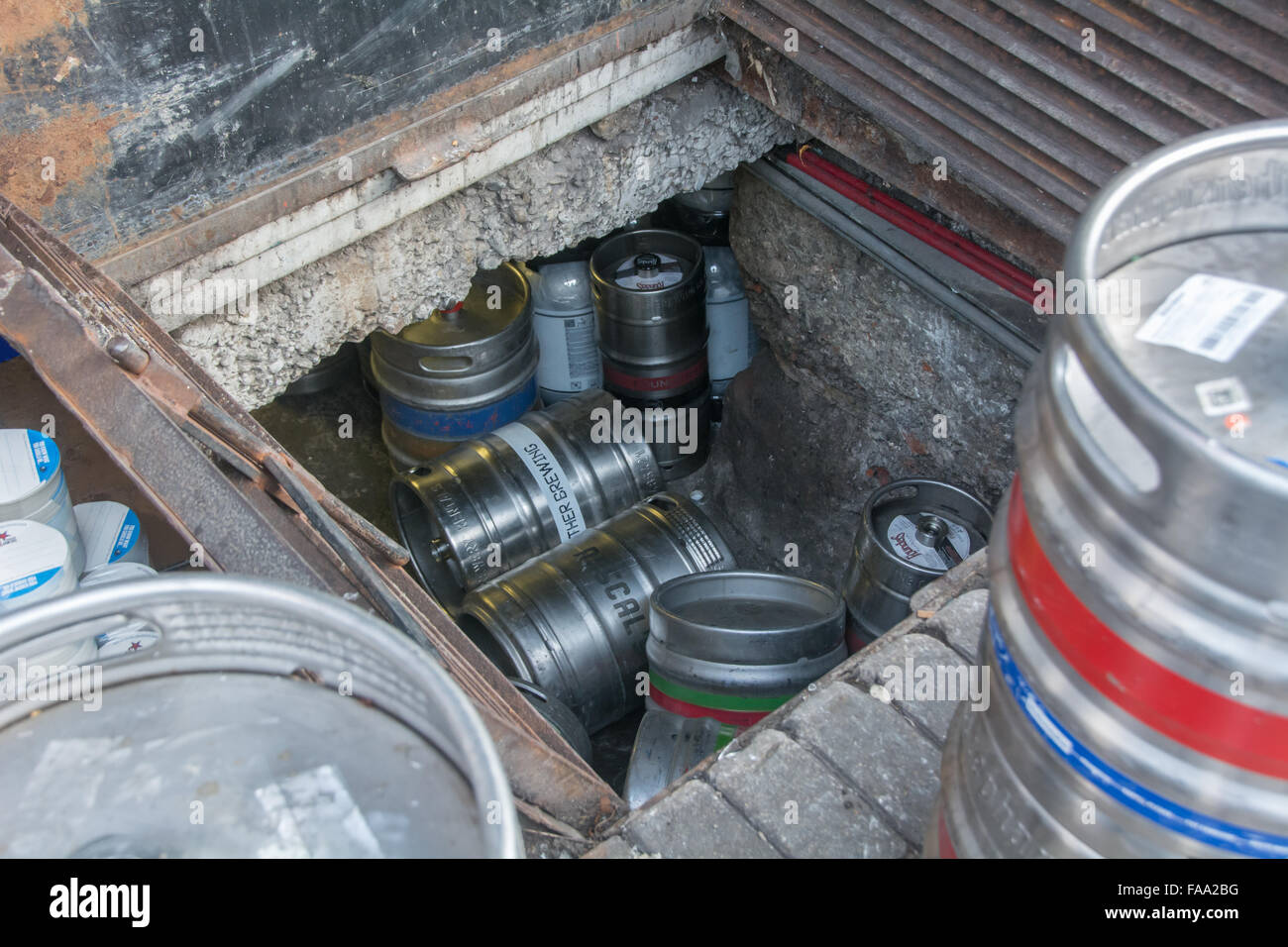 Different types of metal beer kegs being distributed and stored in