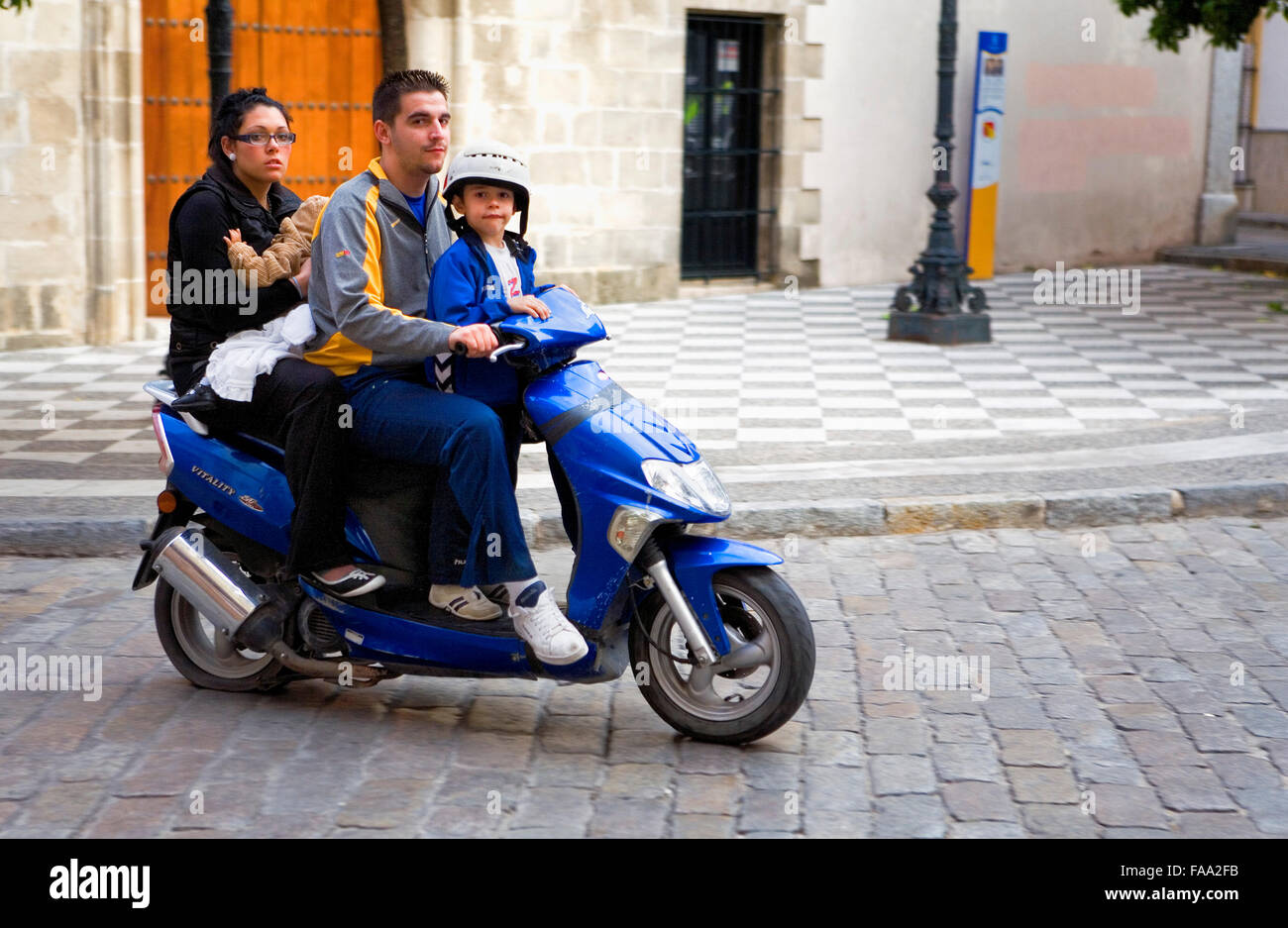 Family on motorbike.Plaza de San Juan.Jerez de la Frontera. Cádiz