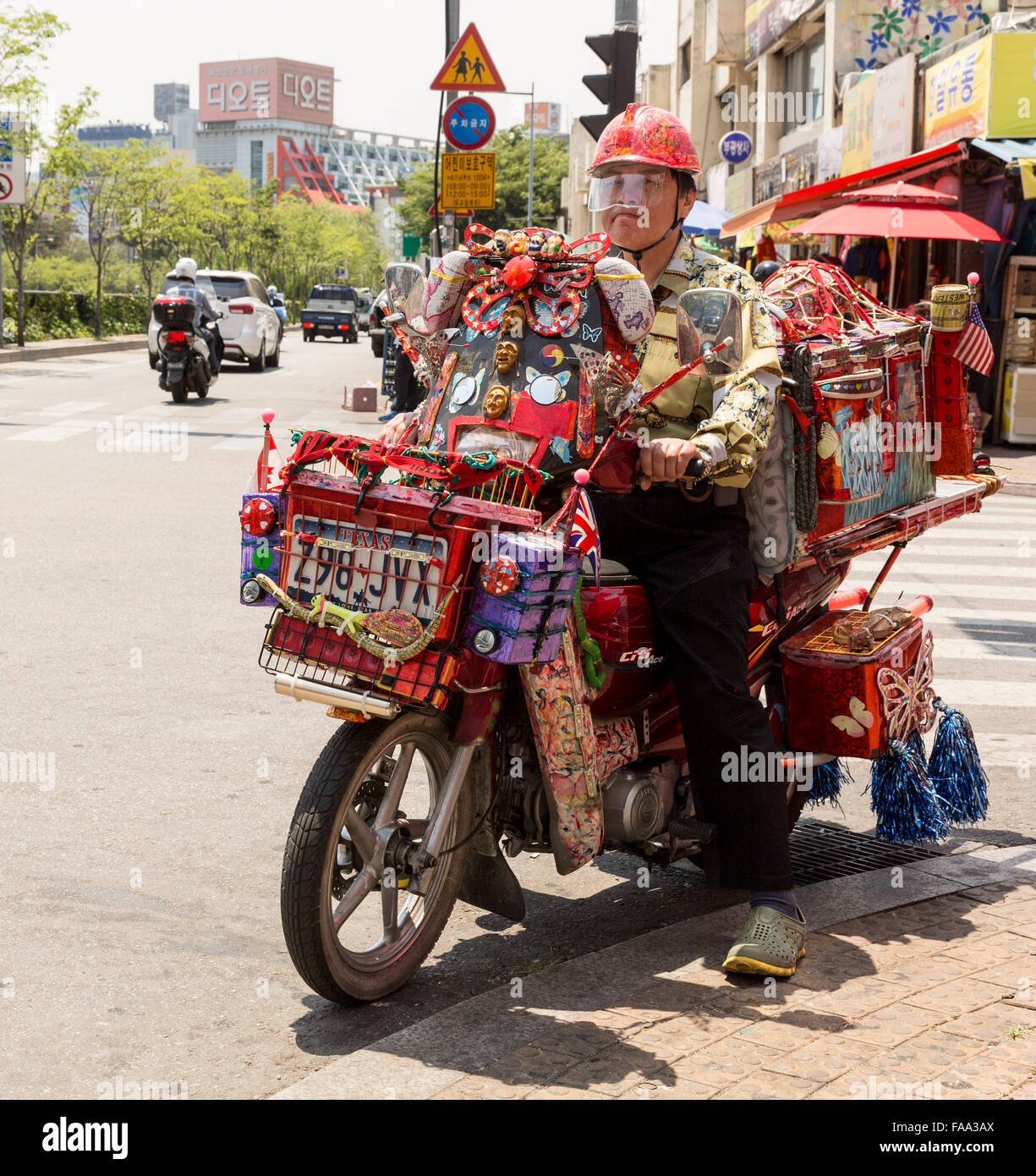 Man riding a weird motorbike in Seoul, South Korea Stock Photo