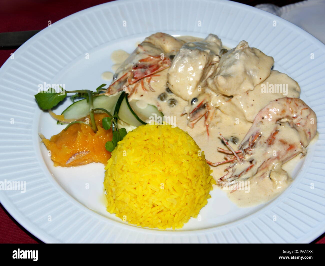 Seychellois cuisine. Fish and shrimp cream sauce with capers. Saffron