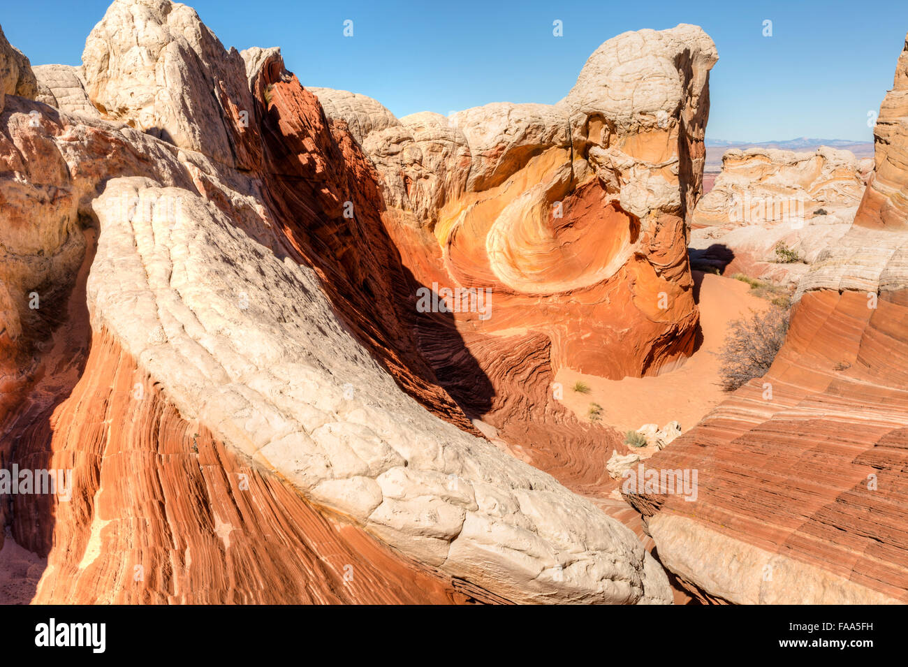 A multi-colored rock formation called 'The Vortex' in the unique White Pocket rock formations in Vermillion Cliffs N.M. Stock Photo