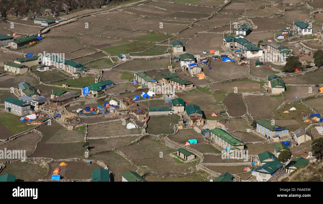 Houses and field in the Sherpa village Khumjung. Sad scene after the Earthquakes in spring 2015. Stock Photo