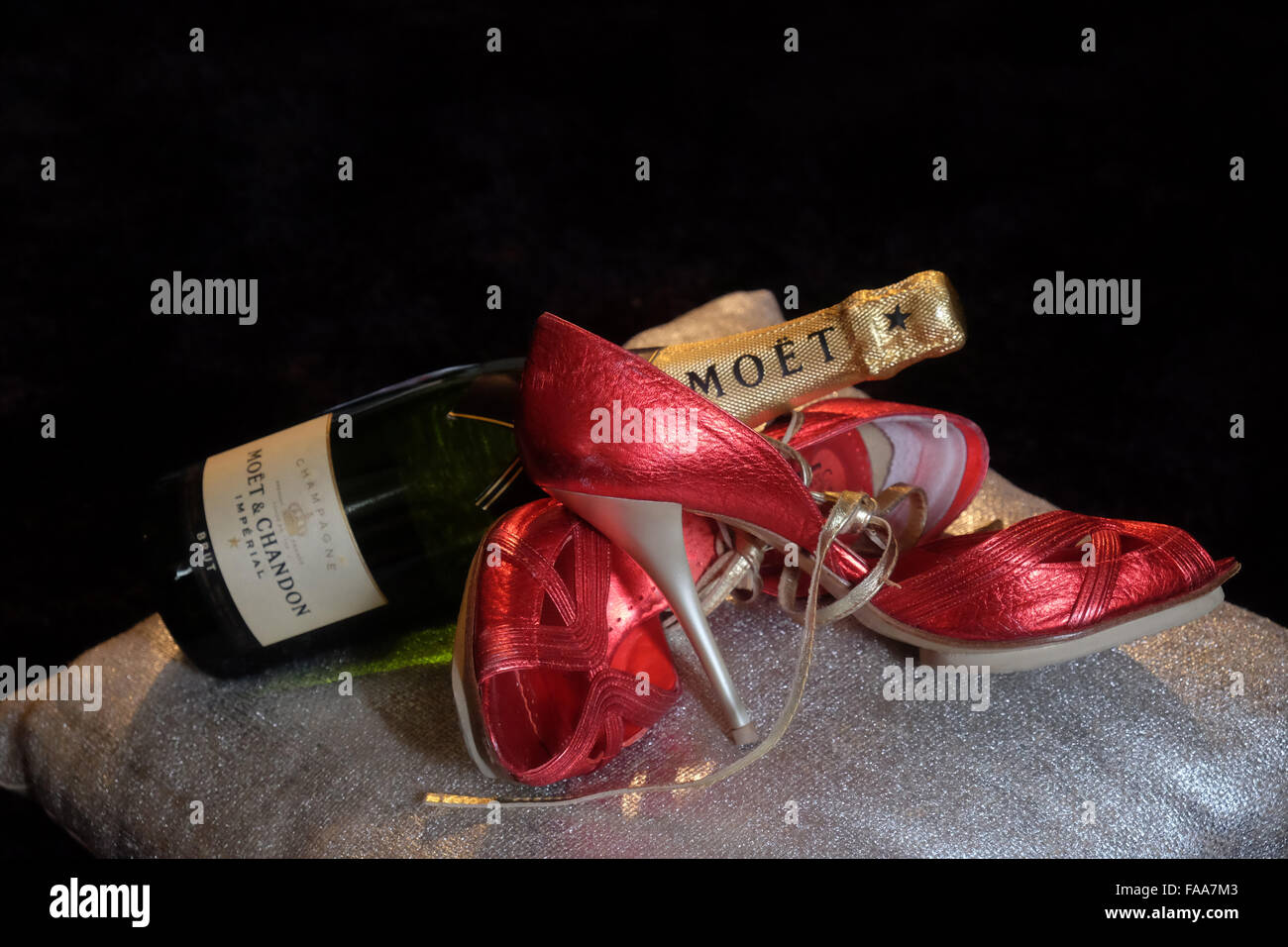 Christmas; celebration; Moet Champagne; Red; High heel; shoes Stock Photo