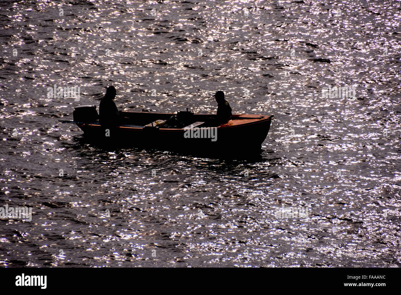 Silhouette Boat in the Ocean Stock Photo - Alamy